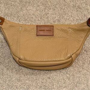 Parker Thatch small cross your heart sling bag in butterscotch.